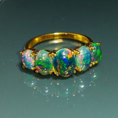 Note- The fire opals are set on a ring on a made-to-order basis, and the upgraded opals or personalized Opal up-gradation have extra charges, DM for the upgrade opal ring price. Best Quality Fire Opals Are Used In 14k Or 18K Gold. Black Ethiopian Opal Gemstone Handmade Jewelry 925 Sterling Silver Ring, Perfect Gift For Your Loved Ones. Handmade Ring, Statement Ring, Proposal Ring, Promise Ring, Wedding Ring. About Ring:- Gemstone - Natural Ethiopian Opal Metal - 925 Sterling Silver/ 14k Solid Go 14k Gold Opal Ring, Black Opal Jewelry, Black Fire Opal, Faberge Jewelry, Opal Birthstone, Australian Black Opal, Black Opal Ring, Opal Wedding Rings, Opal Ring Gold