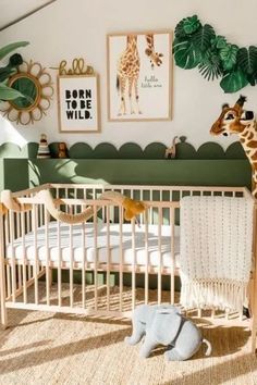 a baby's room with a giraffe in the crib next to a bed