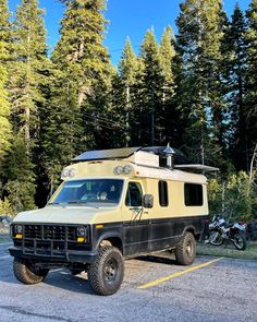 an off road camper parked in a parking lot