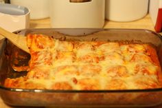 a casserole dish with cheese and meat in it