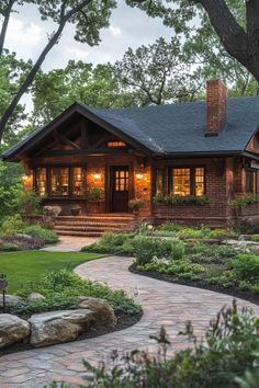 a house that is surrounded by trees and grass