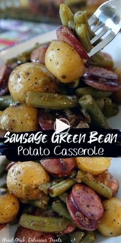 sausage and green bean potato casserole on a white plate with a fork in it