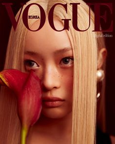 a woman with long blonde hair and a flower in her hand is featured on the cover of a magazine