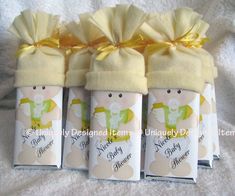 four baby shower products wrapped in yellow ribbon