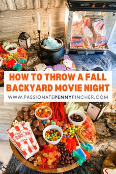 the back yard movie night with candy, candies and other snacks on a table