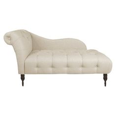 an upholstered chaise lounge chair with wooden legs and tufted backrest