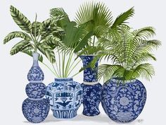 a group of blue and white vases sitting next to each other with plants in them