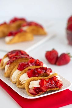 there are many desserts on the plate and one has strawberries in it as well