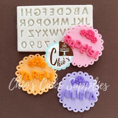 three cookie cutters with the letters and numbers on them, one for each letter