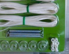 there are several different types of white cords on the green board with screws and nuts