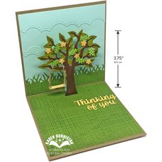 a card with a tree and swing on it