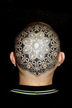 an image of a man's head with tattoos on it