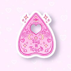 a pink sticker with the words stay in touch written on it and a heart