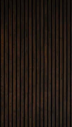 a wooden wall with vertical lines on it