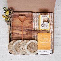 an open box with bread, cookies and other items