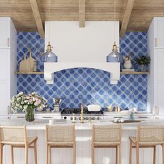 a kitchen with blue and white tiles on the backsplash, counter tops, and chairs