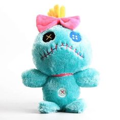 a blue stuffed animal with a pink bow on it's head