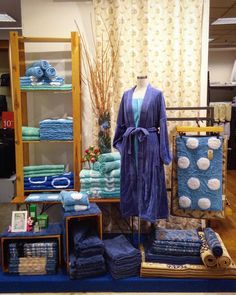 towels and bathrobes are on display in a store