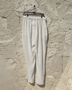 Color: White Size Large-XL Lenght 110 cm / Width 54 cm / Cross: 37 cm Fit: Oversized Fit 2 pockets 100% Cotton Handmade in Tulum, Mexico DeliveryOrders will usually ship whitin 2-3 business days from Tulum, Mexico 100% Delivery Guarantee. If a product you ordered arrived damaged/broken or was lost during delivery -we will resend you the same product again without any additional cost! White Bottoms With Straight Hem For Summer, Neutral Pants With Pockets And Straight Hem, White Relaxed Fit Linen Bottoms, White Cotton Tapered Leg Harem Pants, White Linen Bottoms With Straight Hem, White Harem Pants For Loungewear, Cream Linen Pants With Pockets, White Trousers With Side Pockets, Beige Pants With Pockets For Daywear