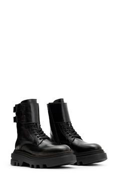 A treaded lug sole and decorative shaft strap bring a bold kick to the classic military boot. 6 1/4" shaft Lace-up style; side zip closure Leather upper and lining/synthetic sole Made in Portugal Utility Styling, Chunky Leather Boots, Chunky Combat Boots, Sacs Tote Bags, Boots Fit, Leather Boots Black, Punk Aesthetic, Coat Shoes, Womens Combat Boots