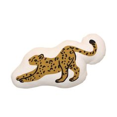 a white and brown cheetah shaped object with black spots on it's body