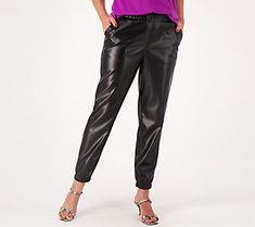 Look stylish and stunning when you don this pair of faux leather joggers. Team them with a bright, beautiful blouse and some leather pumps for an evening out on the town. From LOGO by Lori Goldstein®. Faux Leather Joggers, Leather Jogger Pants, White And Black Cat, Leather Joggers, Cropped Joggers, Pink Bodycon Dresses, Lori Goldstein, Stretchy Pants, Petite Pants