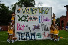 the cheerleaders are doing their thing for the team to do on the banner