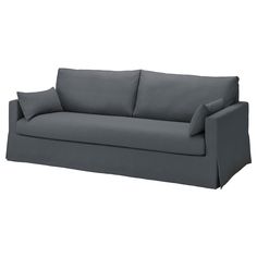 a gray couch with two pillows on it's back and one arm facing the camera