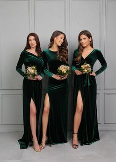 three bridesmaids in green velvet dresses posing for the camera with their bouquets