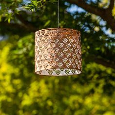 {"Reminiscent of “Tin Art” in a punched luminaria, and made of incredibly durable Tyvek material, the Soji™ Stella solar lantern is a beautiful and unique way to dress up outdoor spaces. The metallic fabric of the Stella Drum shines brilliantly during the day and a high-powered duel LED emits captivating patterns of light by night. Punched with an intricate chevron pattern, this lantern turns on at dusk to create captivating patterns of light each night. Soji™ Solar Lanterns are equipped with on Lantern Gift, Solar Lantern, Chevron Fabric, The Company Store, Tin Art, Led Lantern, Solar Lanterns, During The Day, Pattern Play