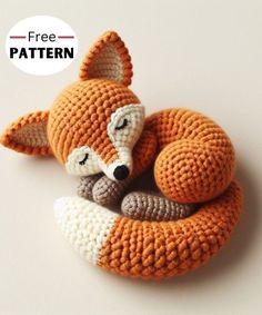 a crocheted stuffed animal laying on top of a white surface with the words free pattern below it