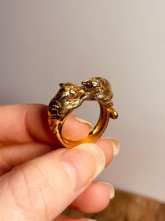 Gold Tiger Snake Ring in brass. This stunning gold brass ring features an intricate design showcasing a fierce tiger entwined with a mesmerizing snake, embodying the perfect balance of strength and elegance. The boho-inspired style incorporates natural motifs, reflecting a connection to nature and spirituality. With its artisan-crafted details and unique character, this ring is a bold statement piece for those who embrace free-spirited fashion. Perfect for layering or wearing solo, it adds a tou Tiger Snake, Natural Motifs, Fierce Tiger, Gold Tiger, Mens Jewellery, Bohemian Festival, Snake Ring, Brass Ring, Unisex Jewelry