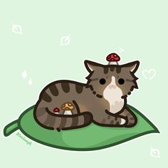 a cat laying on top of a green pillow with a mushroom on its head and eyes