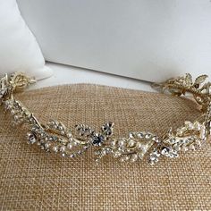 This glamorous bridal headband is a perfect finishing touch for your wedding look. Crafted with gentle scrolls, rhinestones, and tiny pearls, it oozes elegance and sophistication. Let this exquisite headpiece crown your look with grace and beauty.  Lightweight and comfortable, it will make for a beautiful, all-day wear. Expedited shipping available on www.ProBridalUSA.com *Bridal headband measures .75 inch in width.  *High Quality Round rhinestones and pearls. *Ideal for Wedding, Bridal Hair, Anniversary, Quinceanera, Prom, Pageant and Special Occasions. *Each Lucky Collections ™ headband for bride comes in custom luxury box for convenient presentation and keepsake. *Loops on both ends of the Headpiece for stability and security *Fast and Free Shipping from Los Angeles, California. Angeles, Headband For Bride, Headpiece For Wedding, Sparkly Headband, Quinceanera Accessories, Headband With Pearls, Quinceanera Tiaras, Quinceanera Crown, Swarovski Tiara