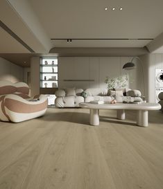 a living room with white furniture and wood flooring on the walls is pictured in this image