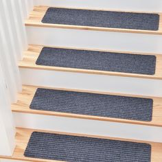 blue carpeted stair treads on wooden steps