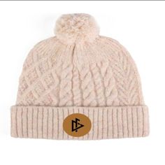 Made with soft and breathable cotton fabric, this beanie provides ultimate comfort and warmth for those chilly days. The beanie features a beautifully stitched DeemedFit logo centered on the front, adding a touch of elegance and sophistication to your outfit. Whether you're heading out for a casual day out or hitting the slopes, this beanie is the perfect addition to complete your look. Its versatile design and neutral color make it easy to pair with any outfit. Stay fashionable and comfortable. Winter Cotton Bonnet Cap, Cotton Winter Bonnet, Adjustable Cotton Winter Bonnet, Winter Cotton Bonnet Hat, Winter Cotton Bonnet, Warm Cotton Hats For Cold Weather, Adjustable Cotton Hats For Winter, Adjustable Cotton Winter Hat, Cream Cotton Winter Hats