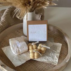 an assortment of items on a tray with some dried grass in the background and a card that says do not feed