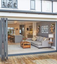 an open living room and dining area with sliding glass doors