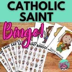 the catholic saint bingo game is shown on a wooden table with pink and blue background