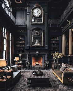 a living room filled with lots of furniture and a clock on top of the wall