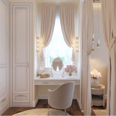 a white desk and chair in a room with curtains on the window sill,