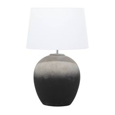 a black and white table lamp with a white shade on the top, against a white background