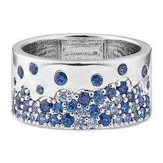 a white gold ring with blue sapphires and diamonds on the sides, set in 18k white gold