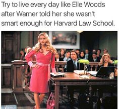 a woman in a pink dress standing next to a desk with people sitting at it