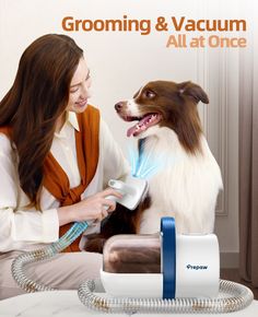 a woman is brushing her dog's teeth with an electric toothbrush and hair dryer