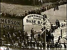 an old black and white photo of people standing in front of a sign that reads hunting avenue base blvd