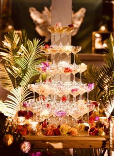 a tiered cake with wine glasses on it