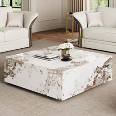 a white marble coffee table in a living room