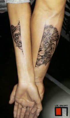 two people holding hands with tattoos on their arms, one has a lion and the other is a bear